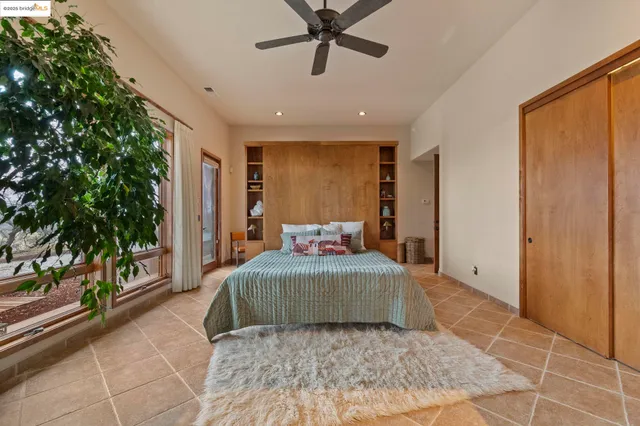 a bedroom with a large bed and a dresser