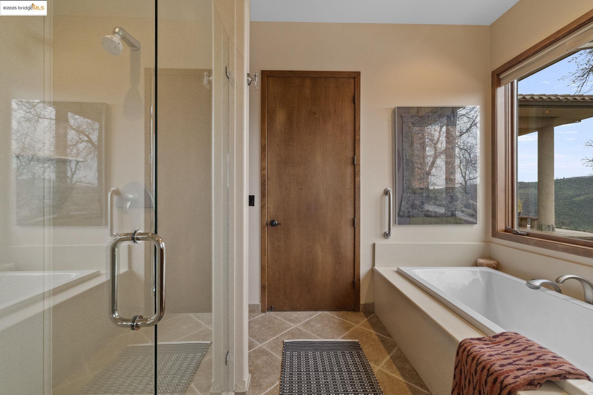 25775 Powell Ranch Road Sonora, CA 95370 - Photo 32 of 60 a bathroom with a tub shower and sink