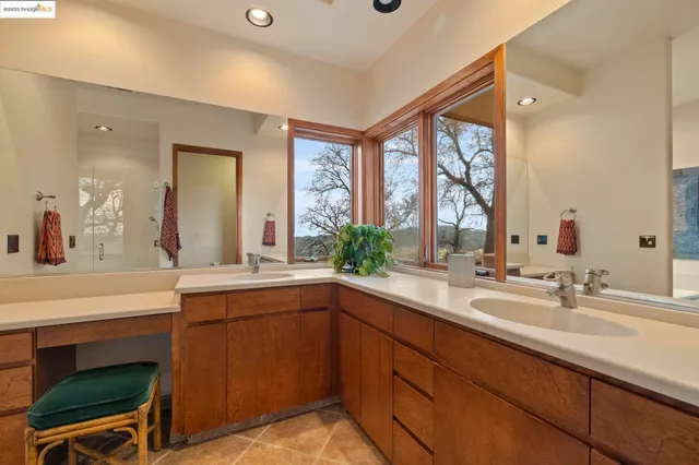 a bedroom with a bed dresser and a window