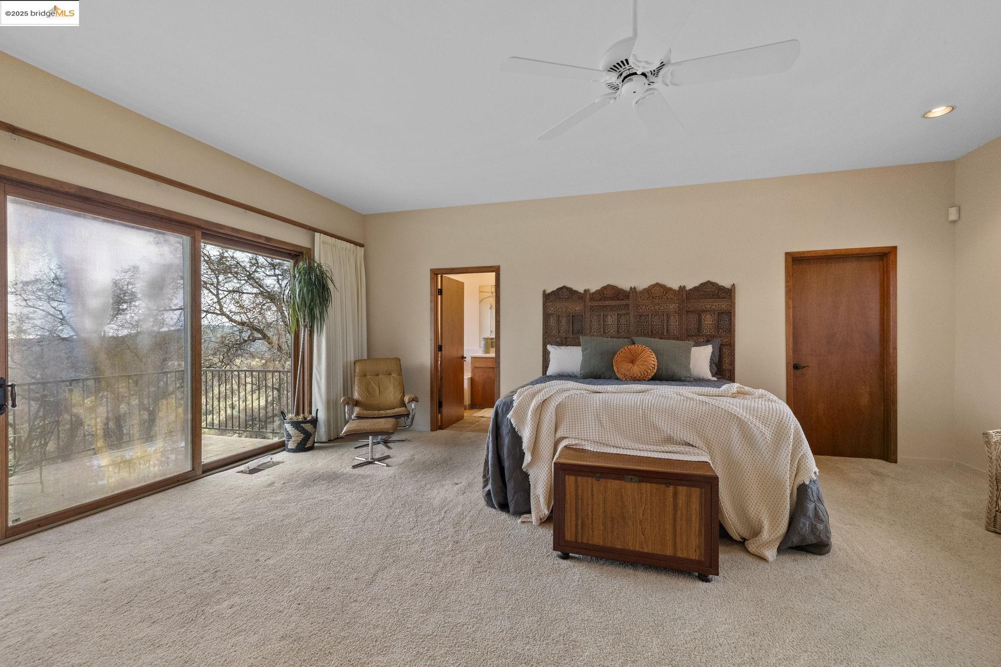 25775 Powell Ranch Road Sonora, CA 95370 - Photo 34 of 60 a bedroom with a bed and large window