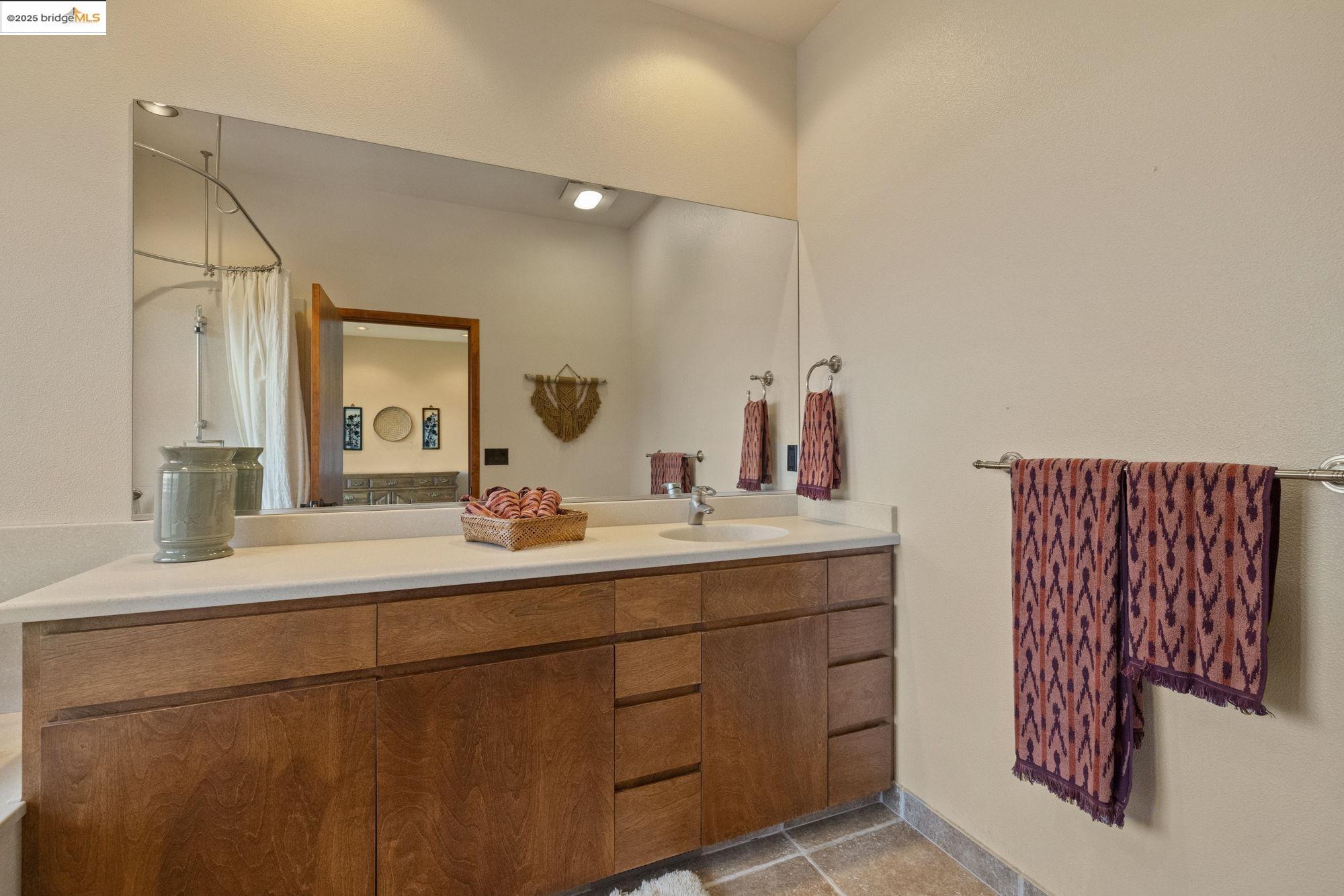 25775 Powell Ranch Road Sonora, CA 95370 - Photo 37 of 60 a bathroom with a sink and a mirror
