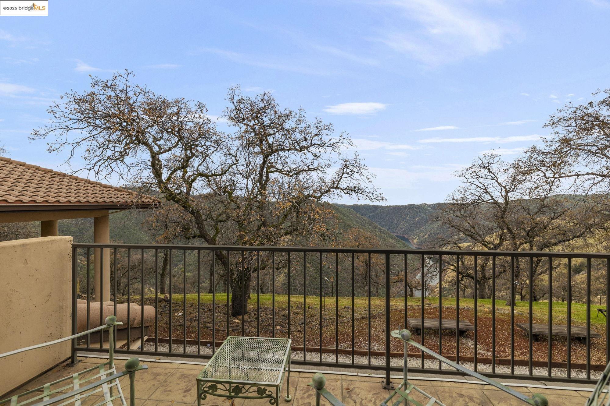 25775 Powell Ranch Road Sonora, CA 95370 - Photo 40 of 60 a view of a terrace with a lake view