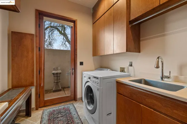 a view of a house with backyard porch and sitting area