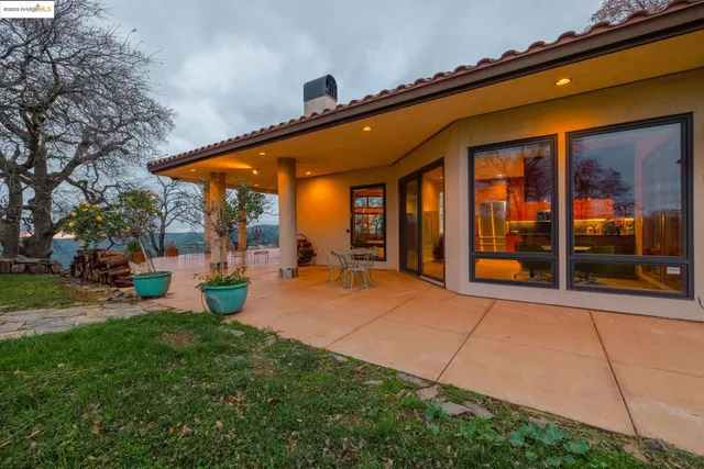 a view of an chairs and table in the room
