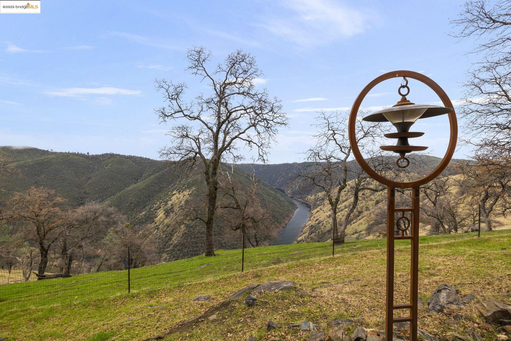 25775 Powell Ranch Road Sonora, CA 95370 - Photo 52 of 60 a front view of a house with garden