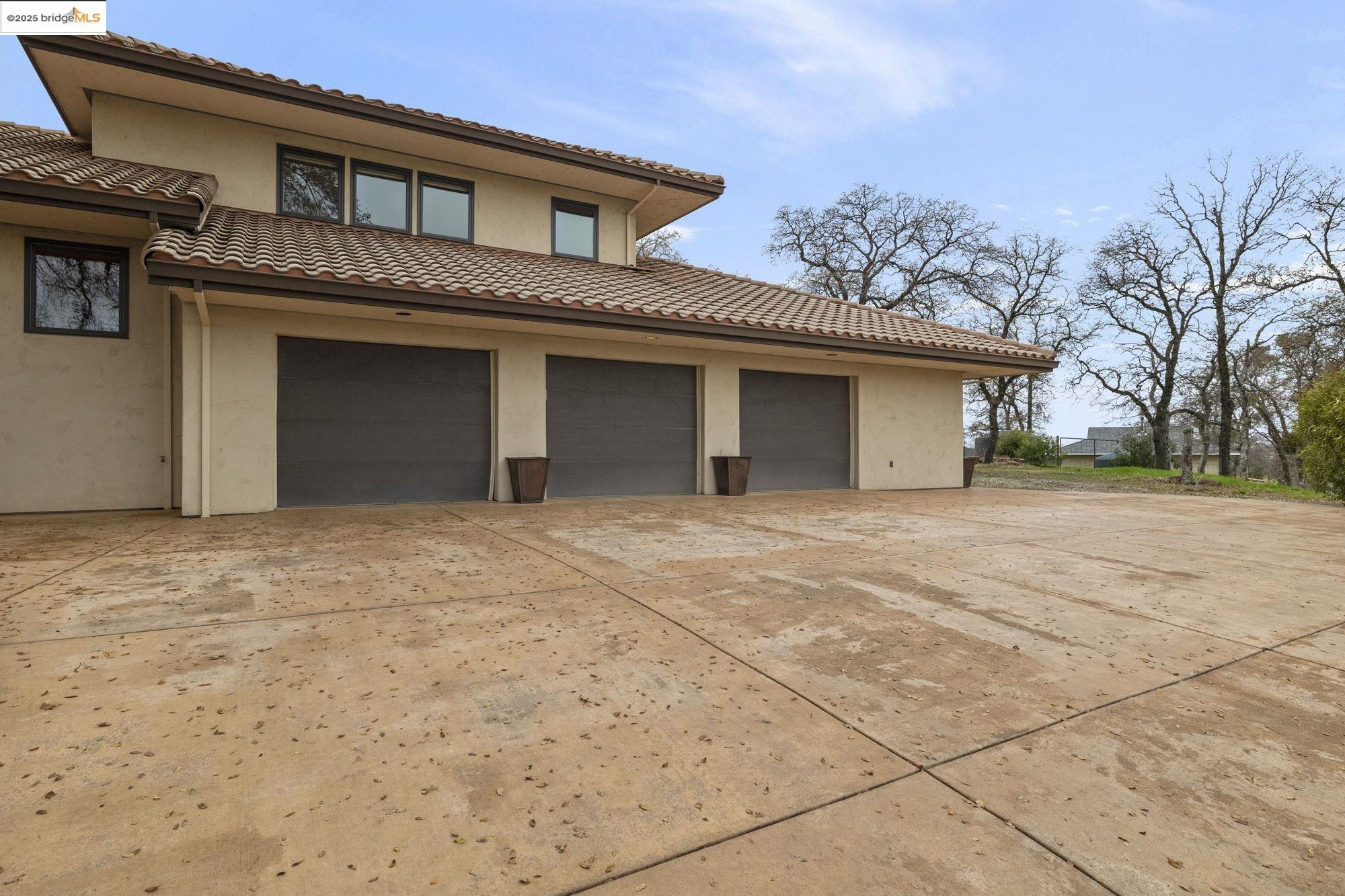 25775 Powell Ranch Road Sonora, CA 95370 - Photo 55 of 60 a view of a house with a yard