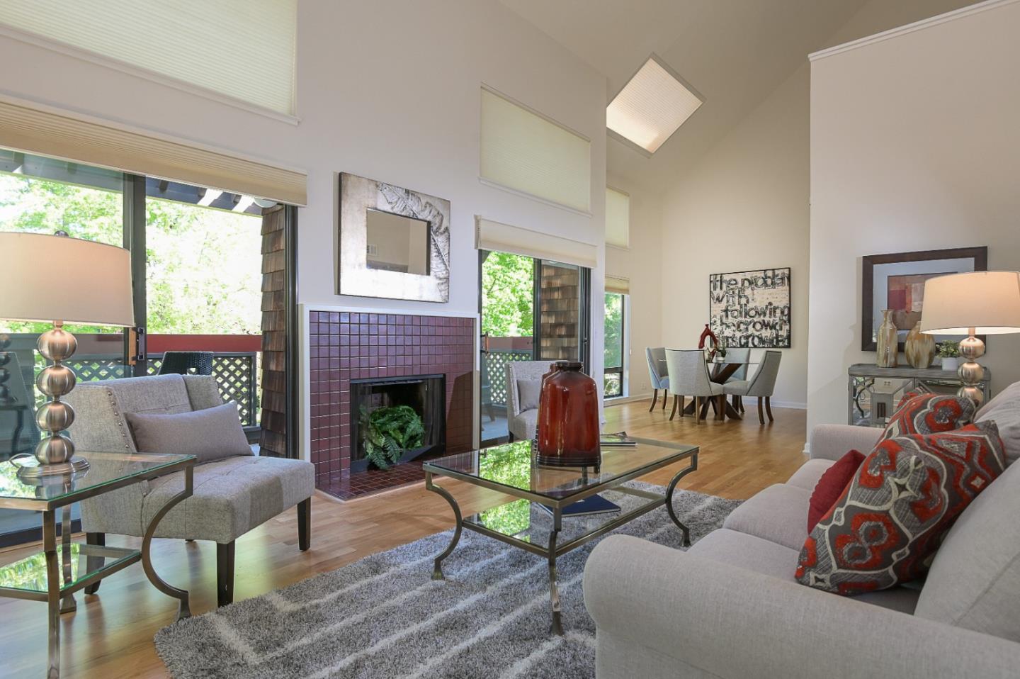 78 Peter Coutts Circle Stanford, CA 94305 - Photo 4 of 12 a living room with furniture a fireplace and a large window