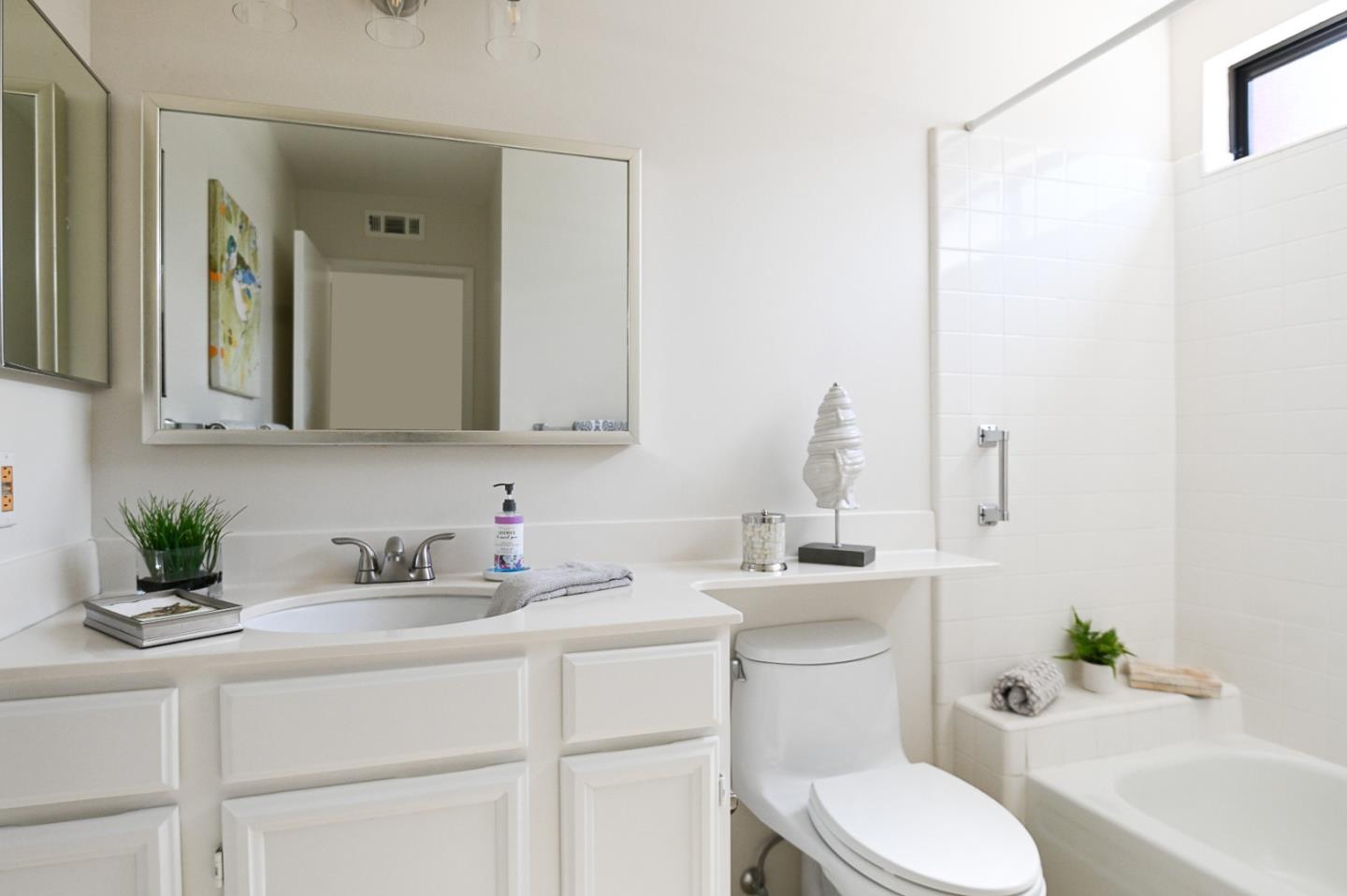 78 Peter Coutts Circle Stanford, CA 94305 - Photo 7 of 12 a bathroom with a sink toilet vanity and tub