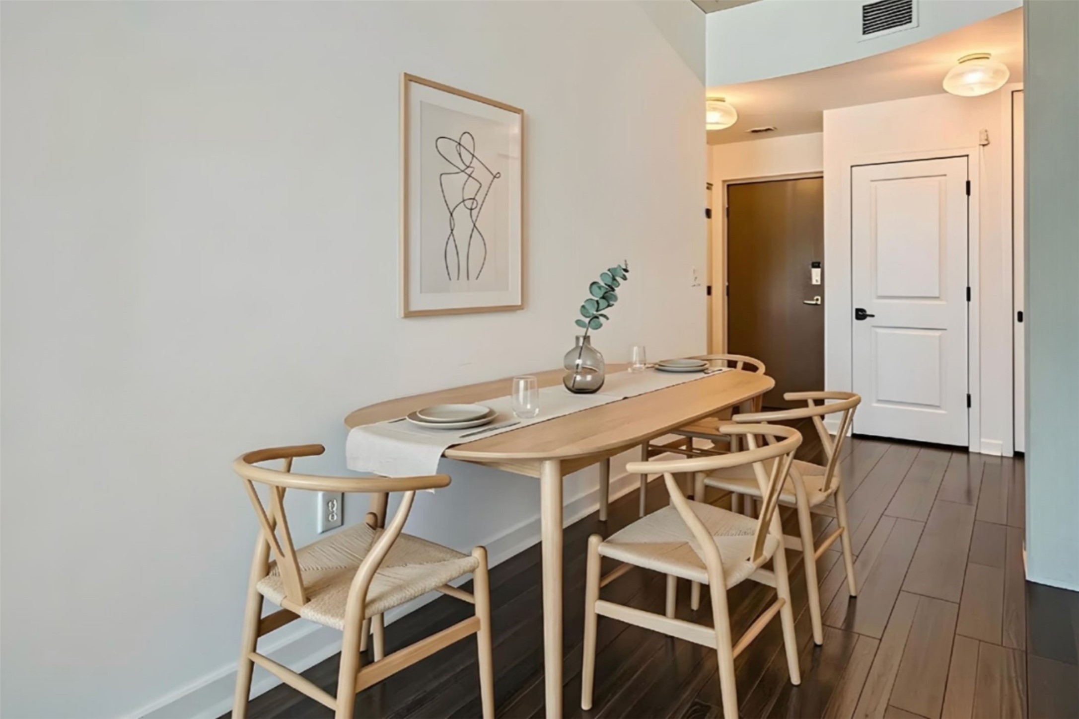 360 Nueces Street, Unit 2004 Austin, TX 78701 - Photo 2 of 34 a view of a dining room with furniture and wooden floor