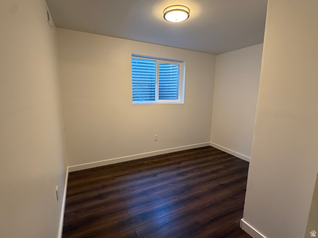 375 East 10560 South Sandy, UT 84070 - Photo 14 of 21 Room featuring wood-finish flooring, white baseboards, a window with horizontal blinds, and a flush-mount ceiling light fixture