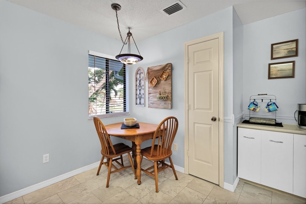 9637 Riverside Drive, Unit 3 Sebastian, FL 32958 - Photo 12 of 36 a dining room with furniture and window