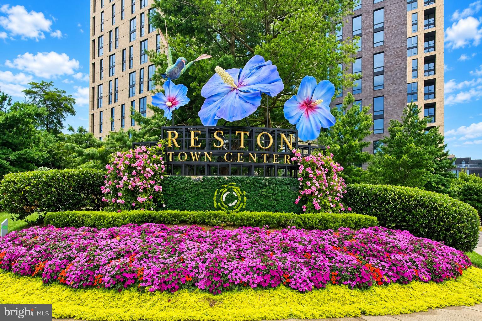 11990 Market Street, Unit 1403 Reston, VA 20190 - Photo 40 of 58 Gorgeous welcoming flowers with a hummingbird