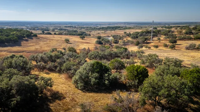 an aerial view of house with yard