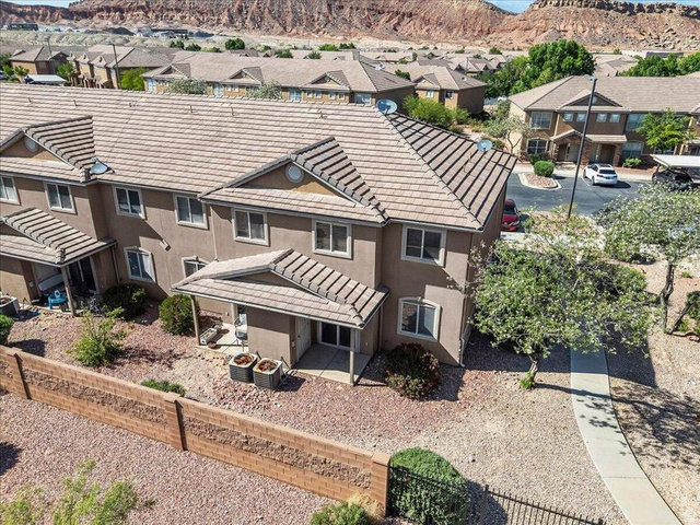 3155 South Hidden Dr Street, Unit 248 St. George, UT 84790 - Photo 19 of 24 Multi-story townhome with stucco exterior and tiled roofing