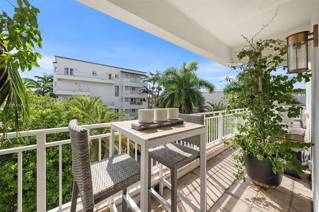 a front view of a building with a garden