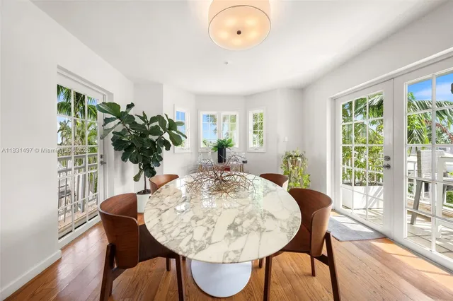 a kitchen with a sink window and cabinets