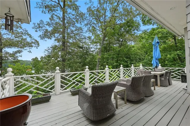 a living room with furniture a large window and a fireplace