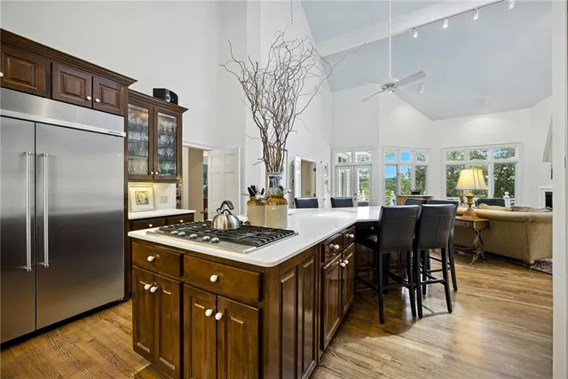 a bedroom with a large bed and a fireplace