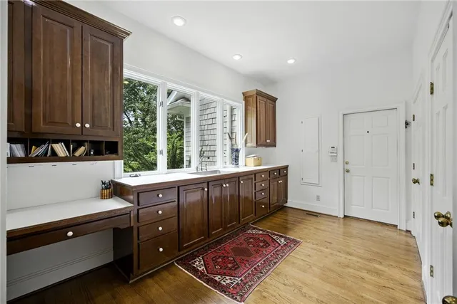 a large bathroom with a large tub and sink