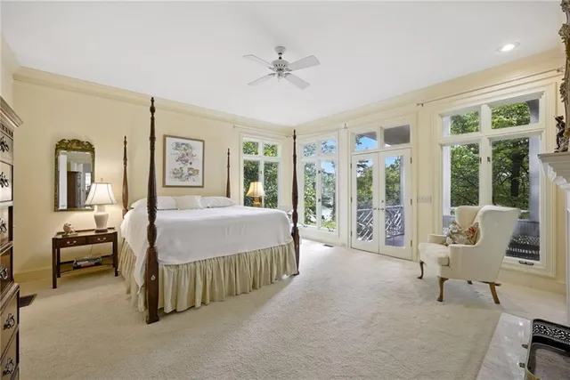 a bath tub sitting in a bathroom next to a window