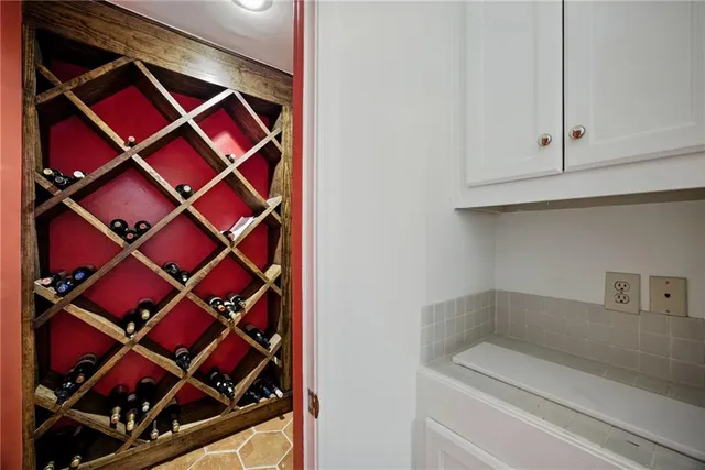 a bedroom with a bed and a chair