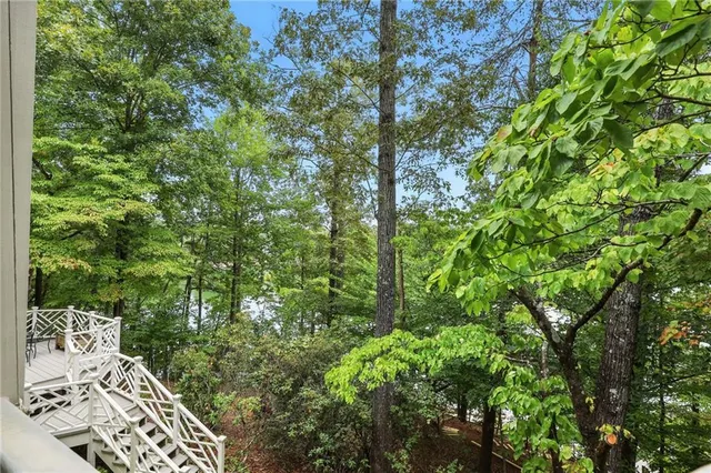 a view of a lake with houses in the back