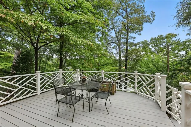 an aerial view of residential houses with outdoor space and lake view