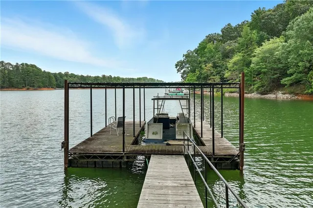 an aerial view of a houses with a lake view