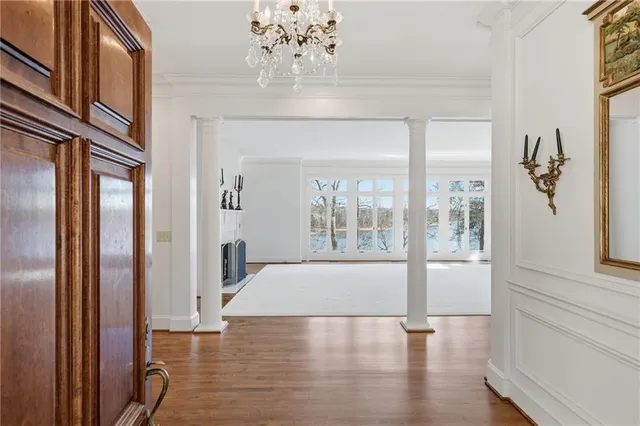 a white bath tub sitting in a room next to a window