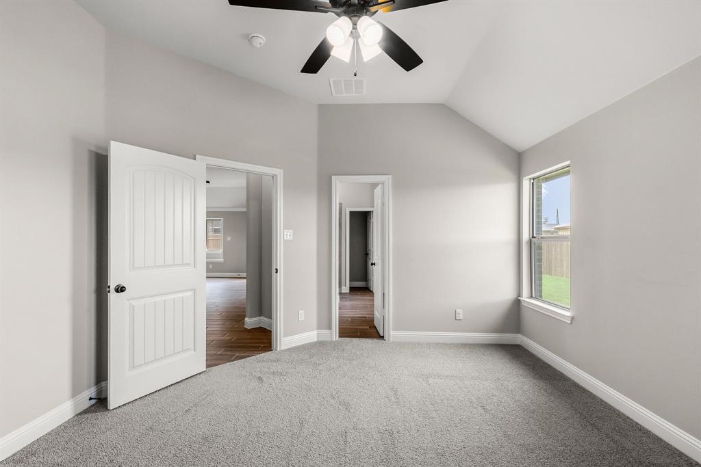 314 Pennington Road Josephine, TX 75173 - Photo 12 of 37 an empty room with chandelier fan and windows