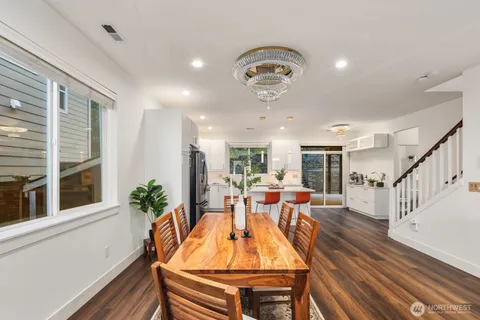 a view of a dining room with furniture window and wooden floor