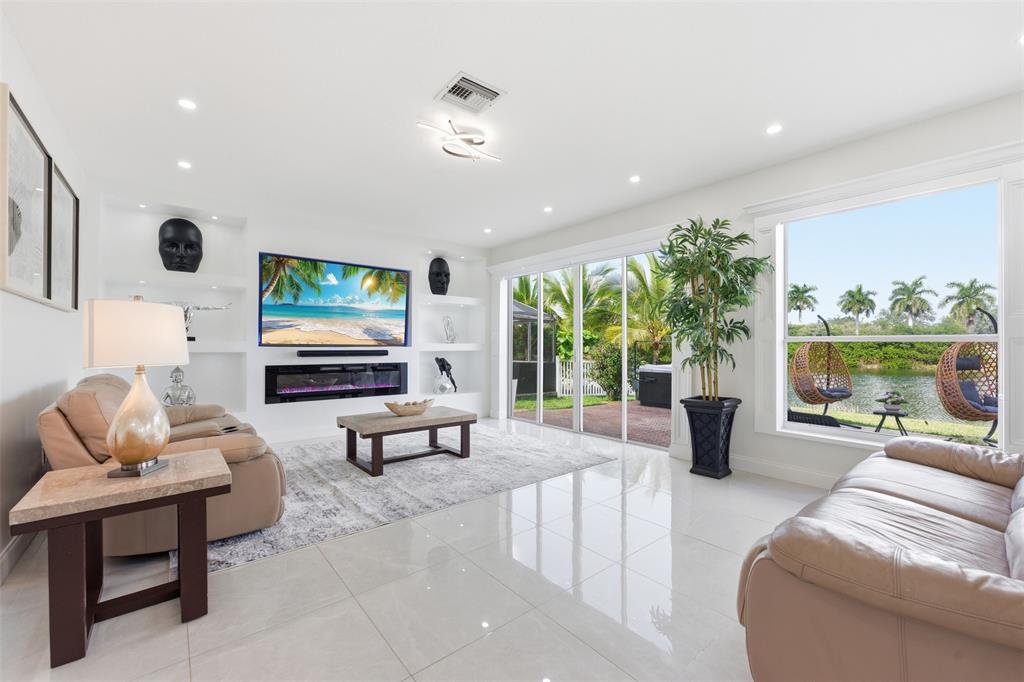 17331 Southwest 33rd Street Miramar, FL 33029 - Photo 18 of 53 a living room with furniture and a flat screen tv
