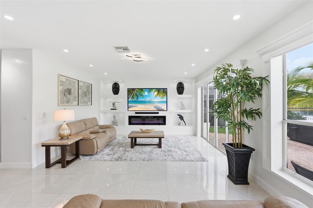 17331 Southwest 33rd Street Miramar, FL 33029 - Photo 19 of 53 a living room with furniture and a potted plant