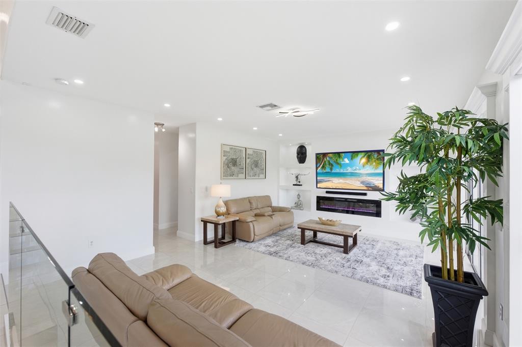 17331 Southwest 33rd Street Miramar, FL 33029 - Photo 20 of 53 a living room with furniture a potted plant and open kitchen view