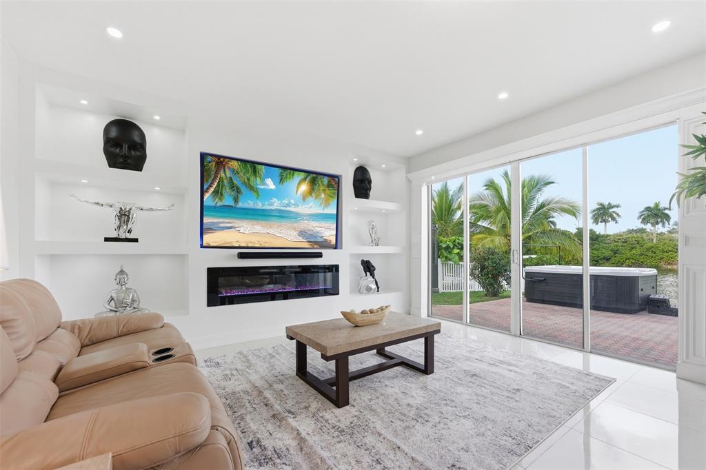 17331 Southwest 33rd Street Miramar, FL 33029 - Photo 21 of 53 a living room with furniture and a flat screen tv