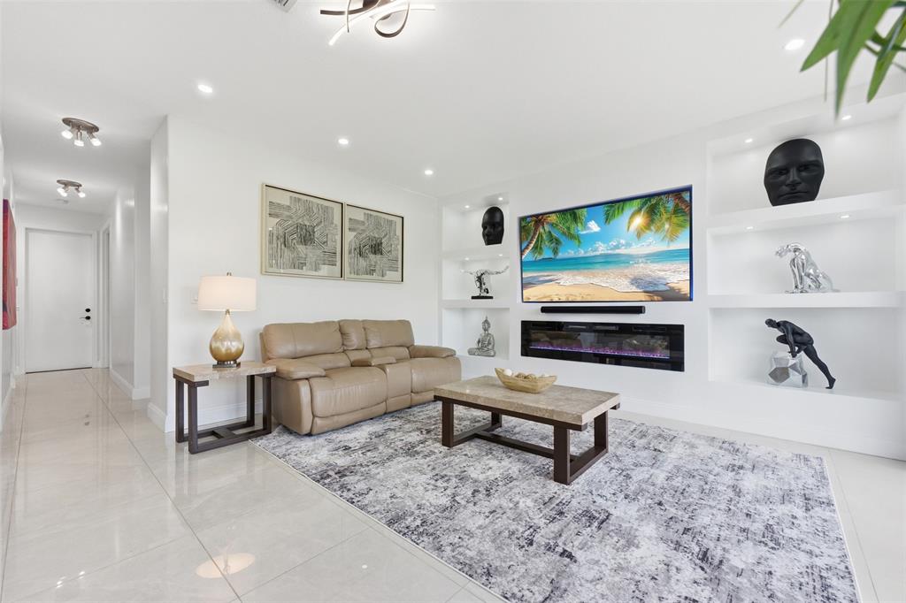 17331 Southwest 33rd Street Miramar, FL 33029 - Photo 22 of 53 a living room with furniture and a flat screen tv