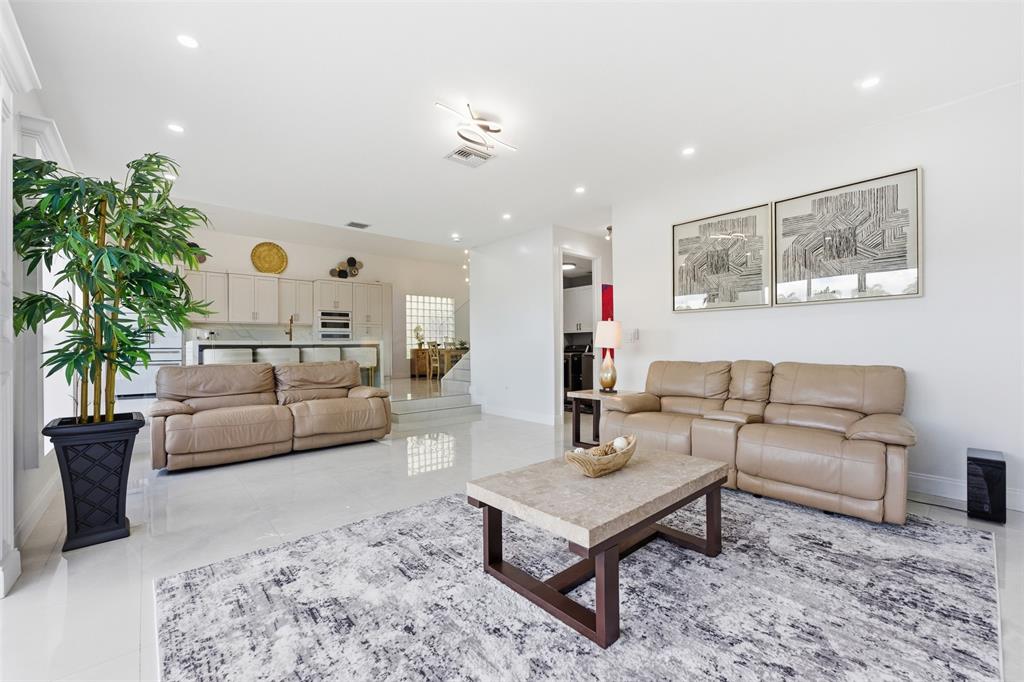 17331 Southwest 33rd Street Miramar, FL 33029 - Photo 23 of 53 a living room with furniture and a potted plant