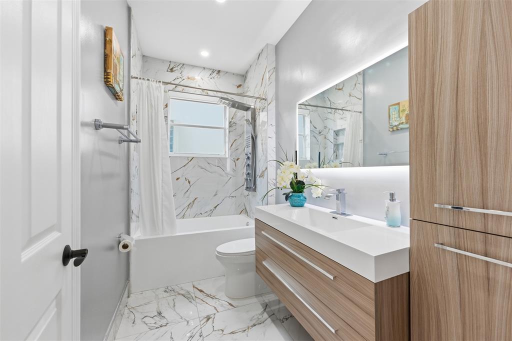 17331 Southwest 33rd Street Miramar, FL 33029 - Photo 28 of 53 a bathroom with a sink a toilet and shower