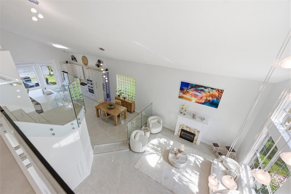 17331 Southwest 33rd Street Miramar, FL 33029 - Photo 32 of 53 a living room with furniture and a flat screen tv