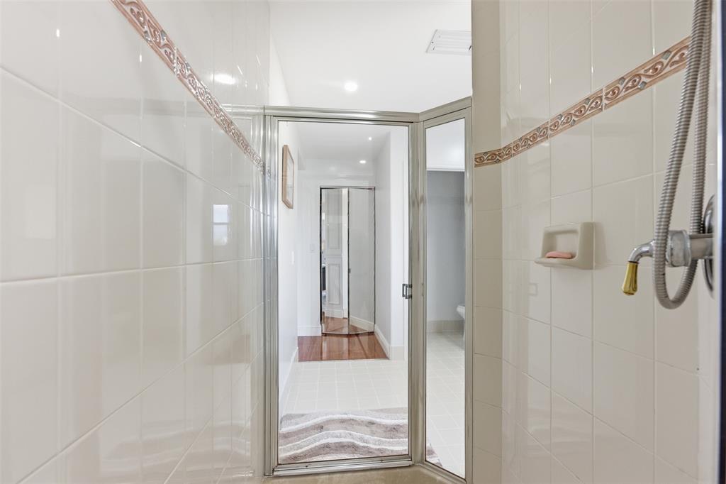 17331 Southwest 33rd Street Miramar, FL 33029 - Photo 40 of 53 a bathroom with a glass shower door