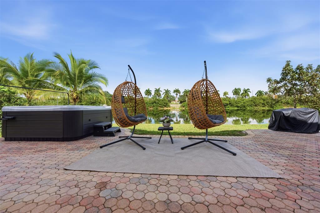 17331 Southwest 33rd Street Miramar, FL 33029 - Photo 48 of 53 a garden view with a sitting space