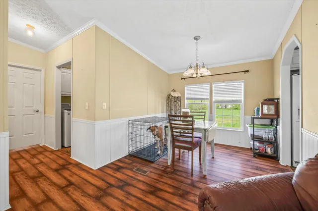 a bedroom with furniture and a window