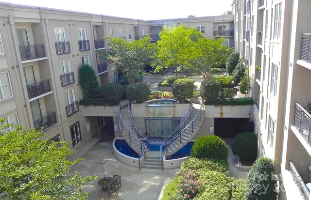 a view of a backyard with sitting area
