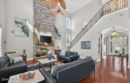 a living room with fireplace furniture and a flat screen tv