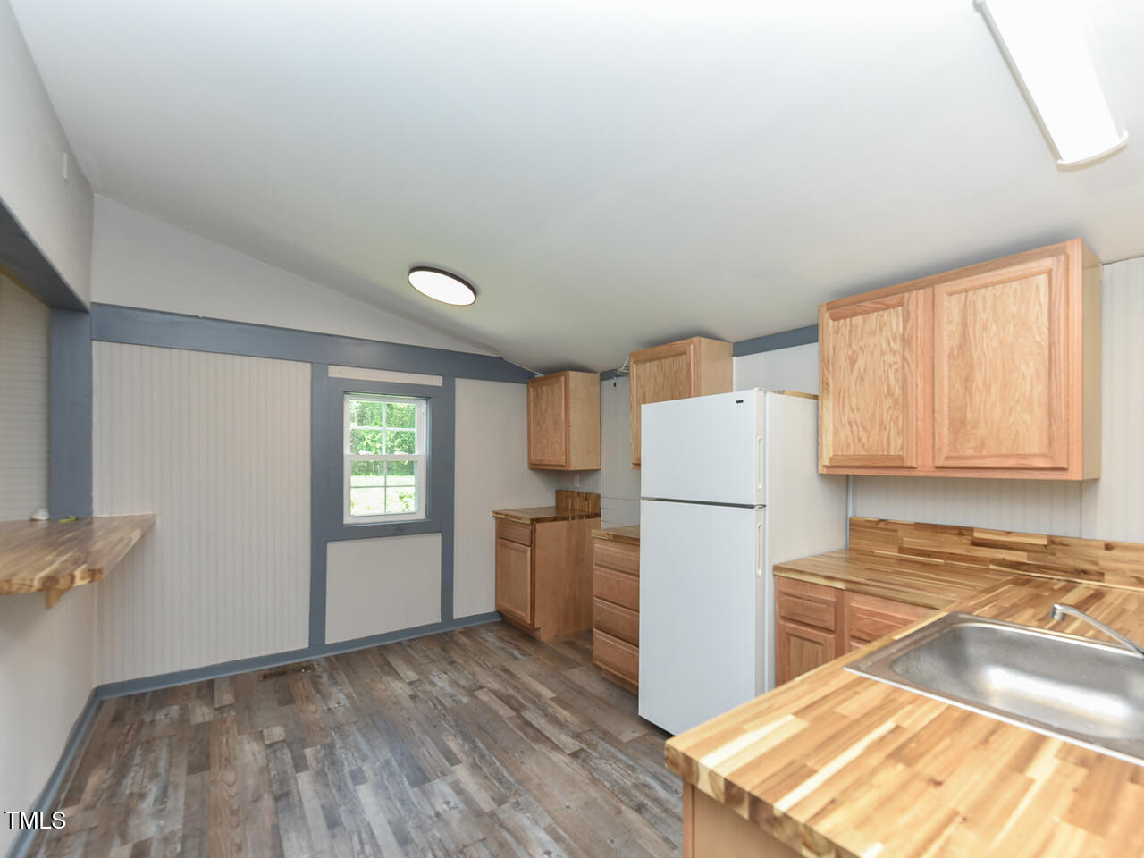 232 Mitchell Farm Road Goldsboro, NC 27530 - Photo 18 of 82 a kitchen with a refrigerator and microwave
