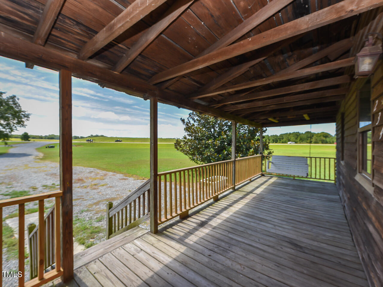 232 Mitchell Farm Road Goldsboro, NC 27530 - Photo 2 of 82 a view of a balcony with wooden floor