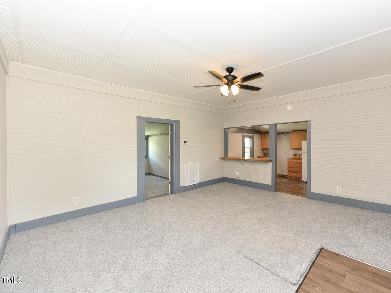 232 Mitchell Farm Road Goldsboro, NC 27530 - Photo 21 of 82 an empty room with chandelier fan and windows