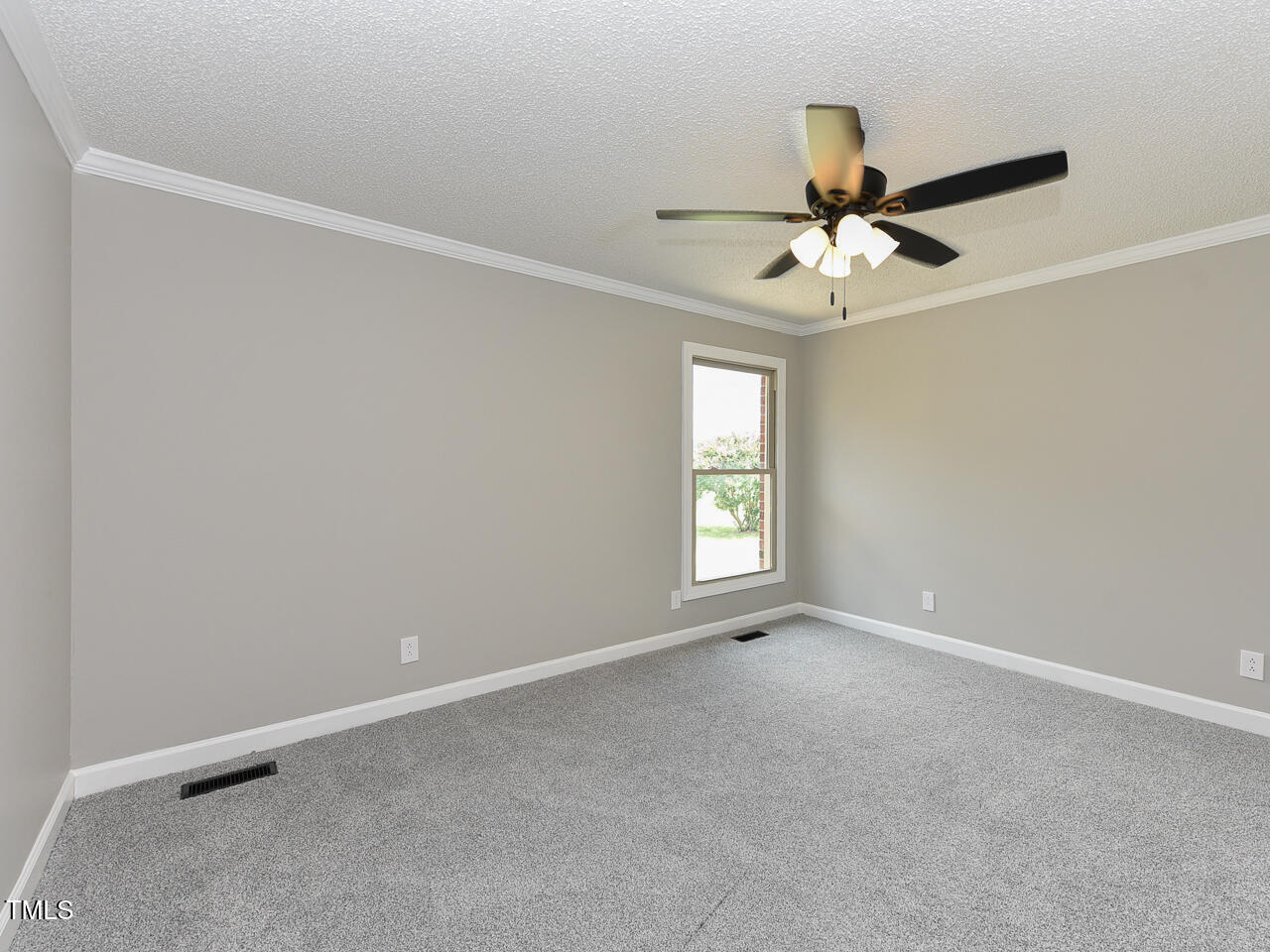 232 Mitchell Farm Road Goldsboro, NC 27530 - Photo 31 of 82 an empty room with windows and fan