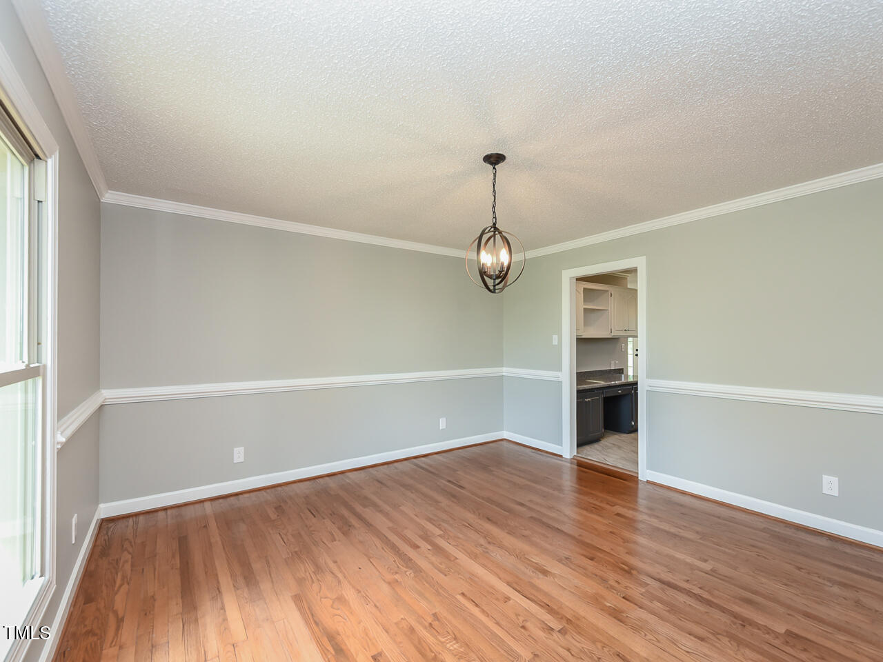 232 Mitchell Farm Road Goldsboro, NC 27530 - Photo 33 of 82 a view of empty room with wooden floor and window