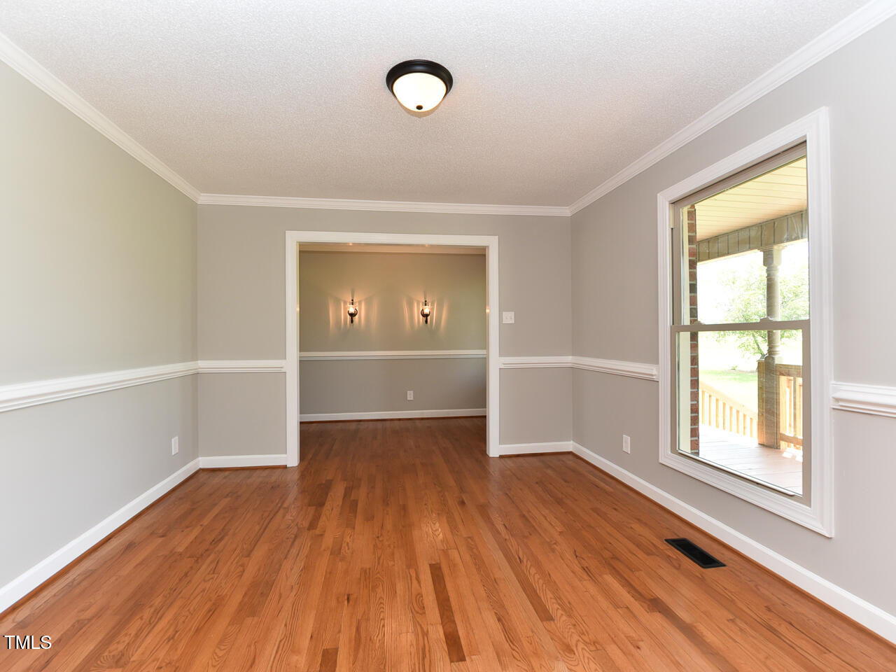 232 Mitchell Farm Road Goldsboro, NC 27530 - Photo 34 of 82 an empty room with wooden floor and windows
